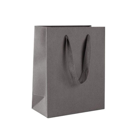 White purse style gift bag made from a 380gsm fsc certified board White purse style gift bag made from a 380gsm fsc certified board